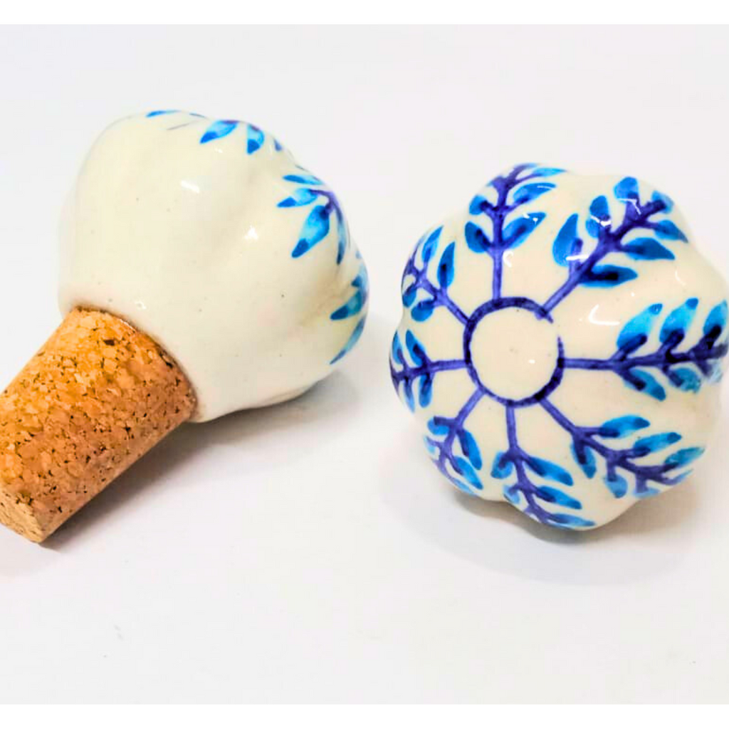 Decorative cork with a white base and blue floral patterns on a white background